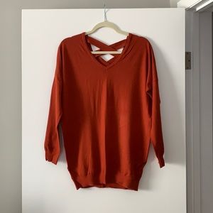 Rust colored sweater with lace up back